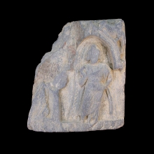a-gandharan-grey-schist-fragment-depicting-a-figure-standing-within-a-naiskos_x5858a