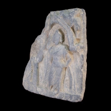 a-gandharan-grey-schist-fragment-depicting-a-figure-standing-within-a-naiskos_x5858b