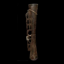 a-large-old-asmat-carved-drum;-remnant-red-and-white-pigment_t3278a
