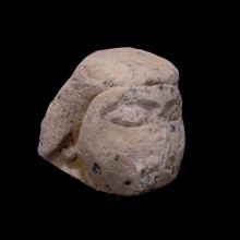 a-limestone-canopic-jar-lid-in-the-form-of-imsety_00914b