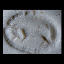 a-phoenician-clay-bulla-the-image-depicting-a-prancing-bull_e8113b