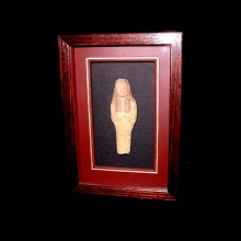 a-pottery-ushabti-with-traces-of-yellow-slip-on-body-and-black-on-wig_a5574b