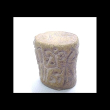 an-ancient-indian-baked-clay-cylinder-seal-with-scrolling-designs.--very-minor-ancient-loss,-otherwise-intact_06106b