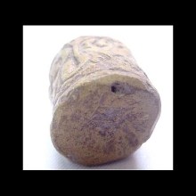 an-ancient-indian-baked-clay-cylinder-seal-with-scrolling-designs.--very-minor-ancient-loss,-otherwise-intact_06106c