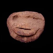 an-archaic-dogon-stone-carving-in-the-form-of-an-animal-face-with-simian-features_t5729a