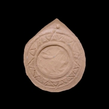 an-early-islamic-clay-seal-amulet,-depicting-a-lion-within-a-border-of-triangle-designs_09660b