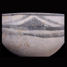 an-indo-iranian-pottery-vessel-with-geometric-painted-motif-in-black-pigment-around-rim-and-incised-linear-motif-on-body_x1040c