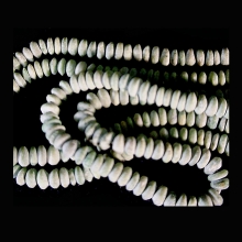 hansalu-miniature-faience-disc-shaped-beads-strung-as-a-necklace_e8079b